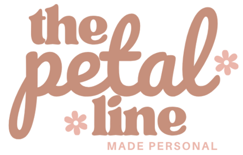 Logo for 'the petal line' with a floral design on a transparent background